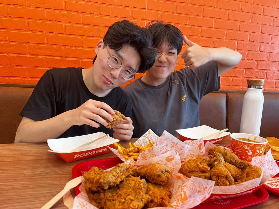 Two friends sharing a restaurant meal during an IB Director gathering