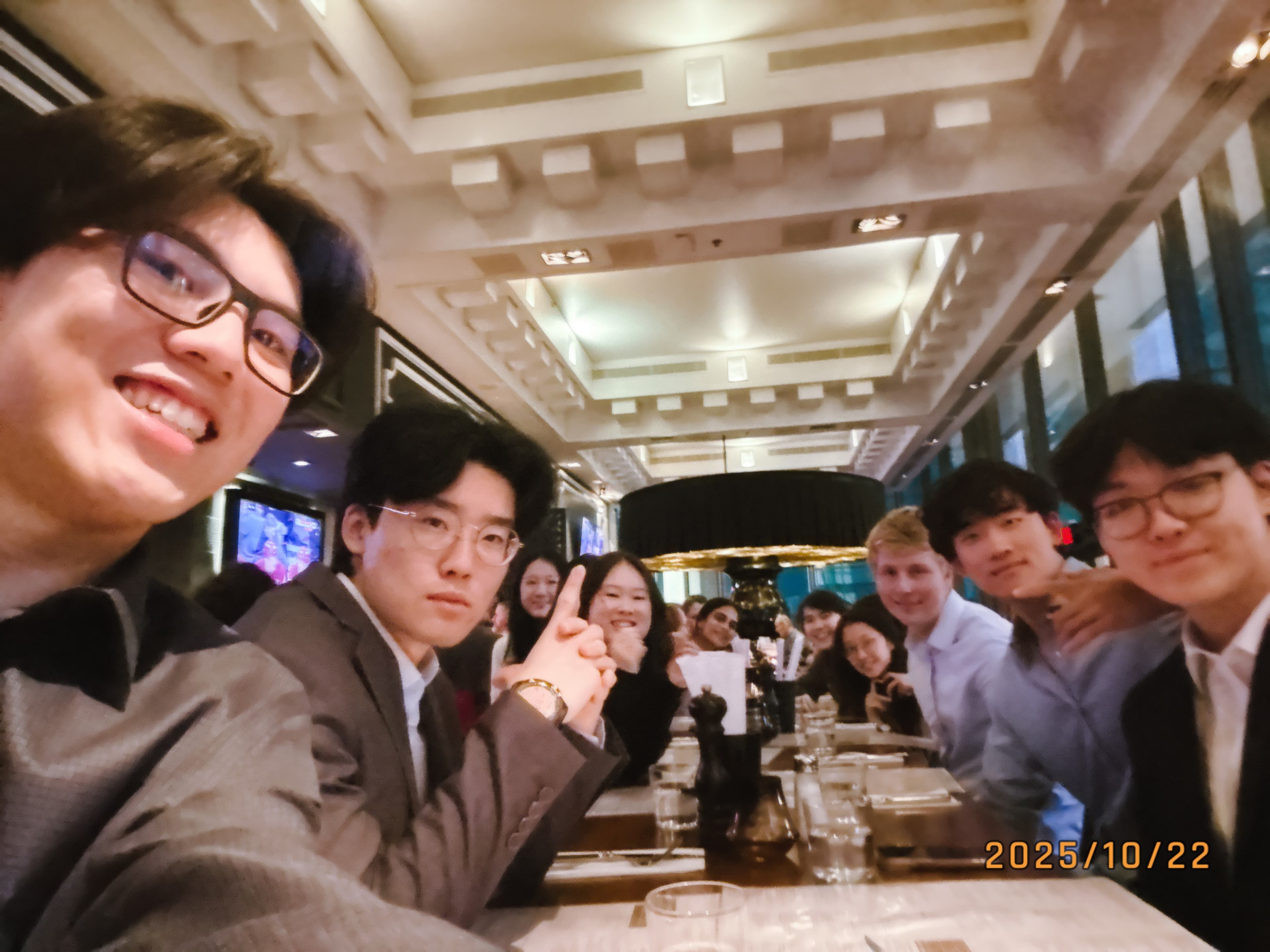 A group seated together at a dinner table during an IB Director dinner