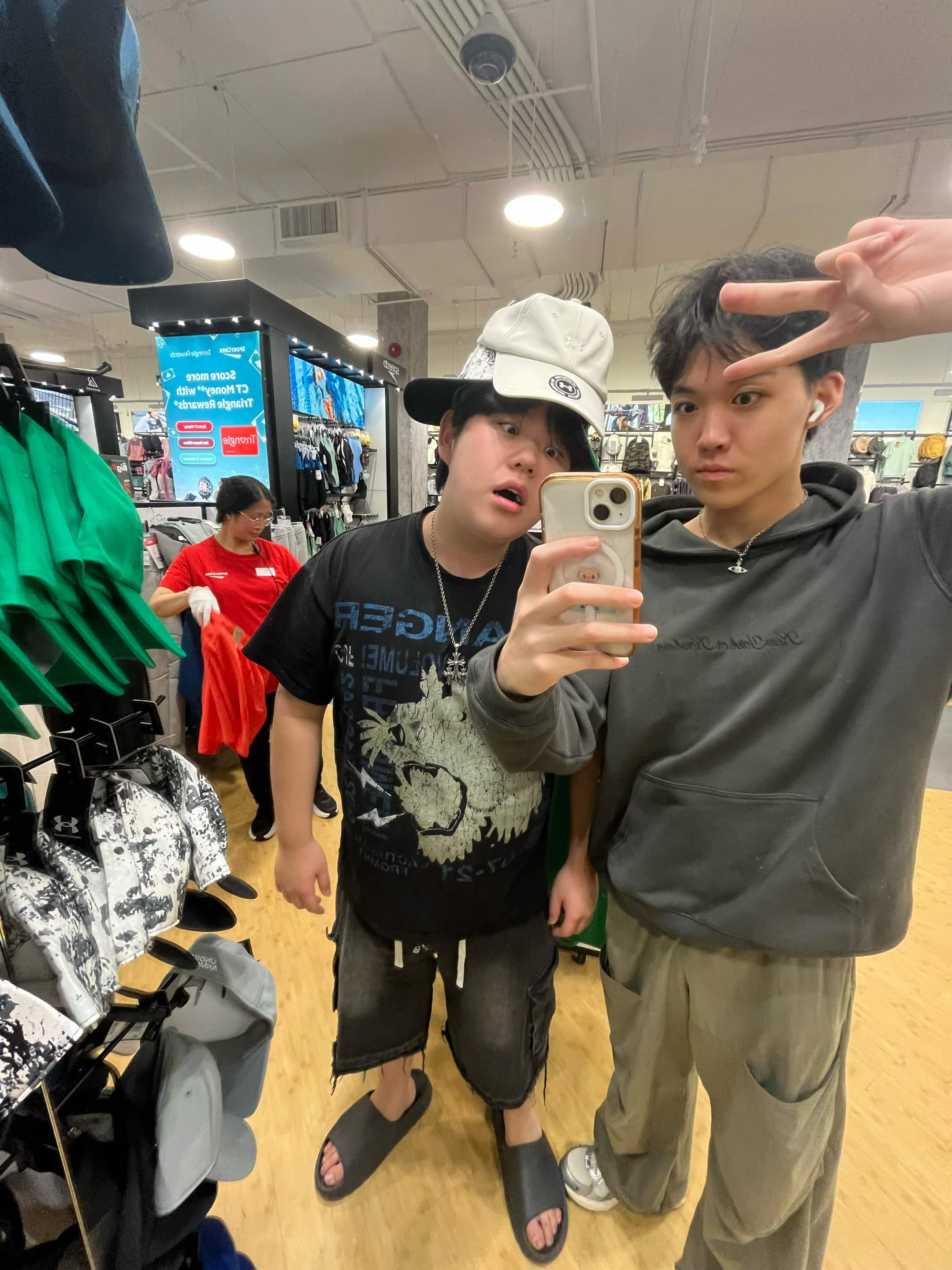 Mason and his friend taking a playful mirror photo